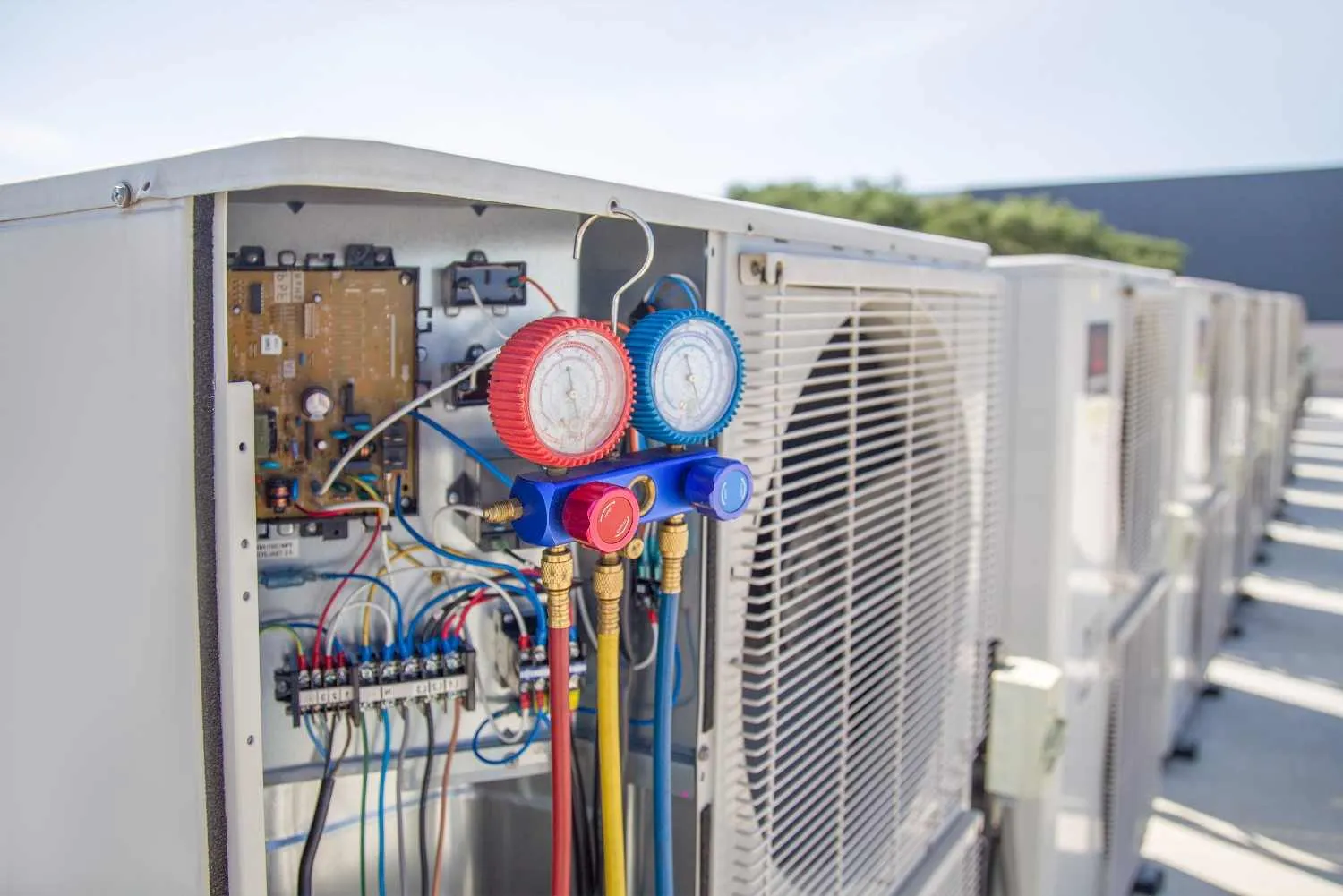 Outdoor air conditioner unit with pressure gauges attached